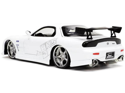 White sports car with black accents on a white background