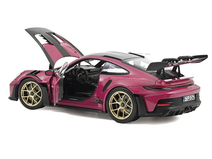 Model car with open doors on a white background