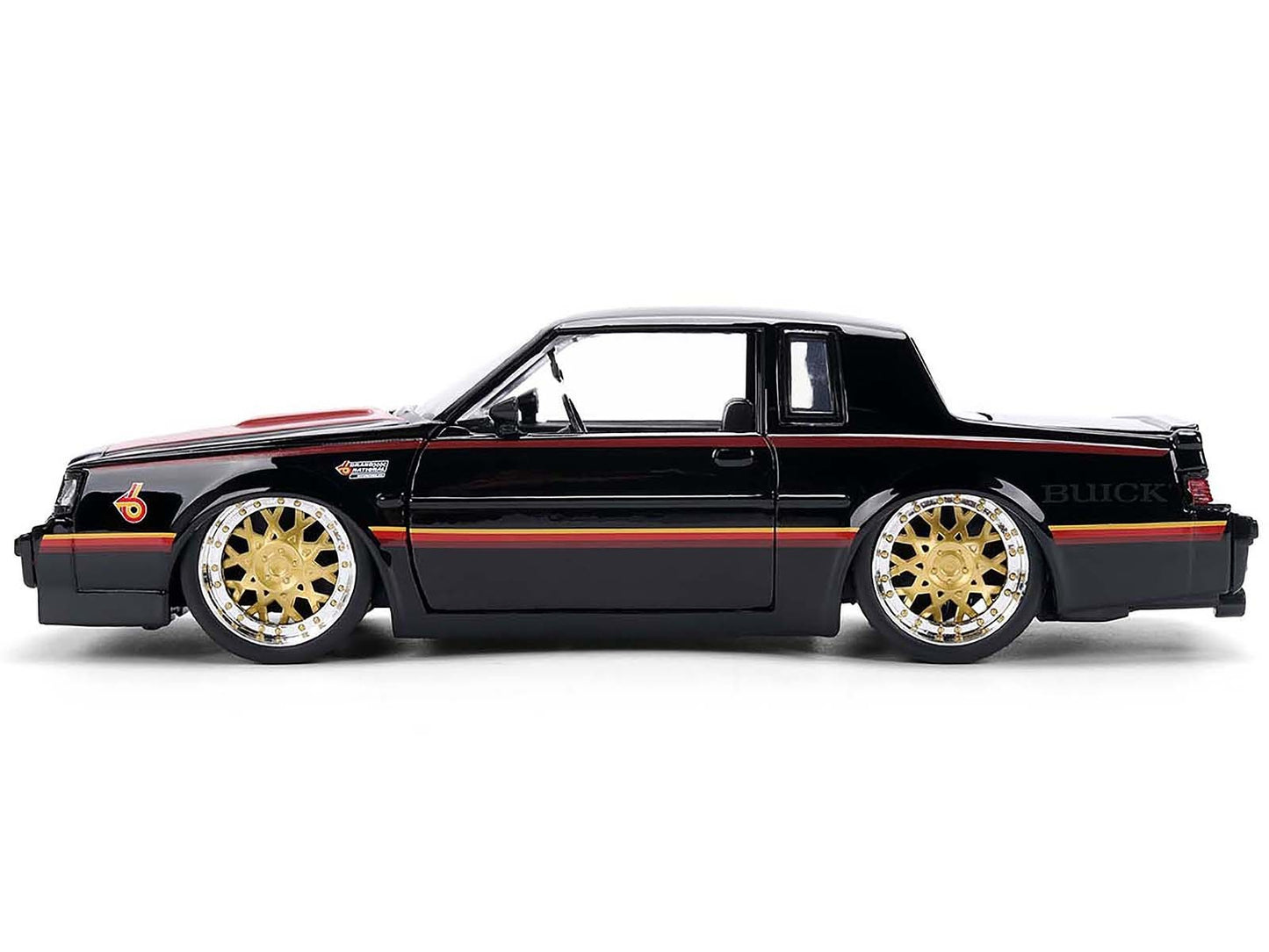 Black Buick car with gold rims on a white background