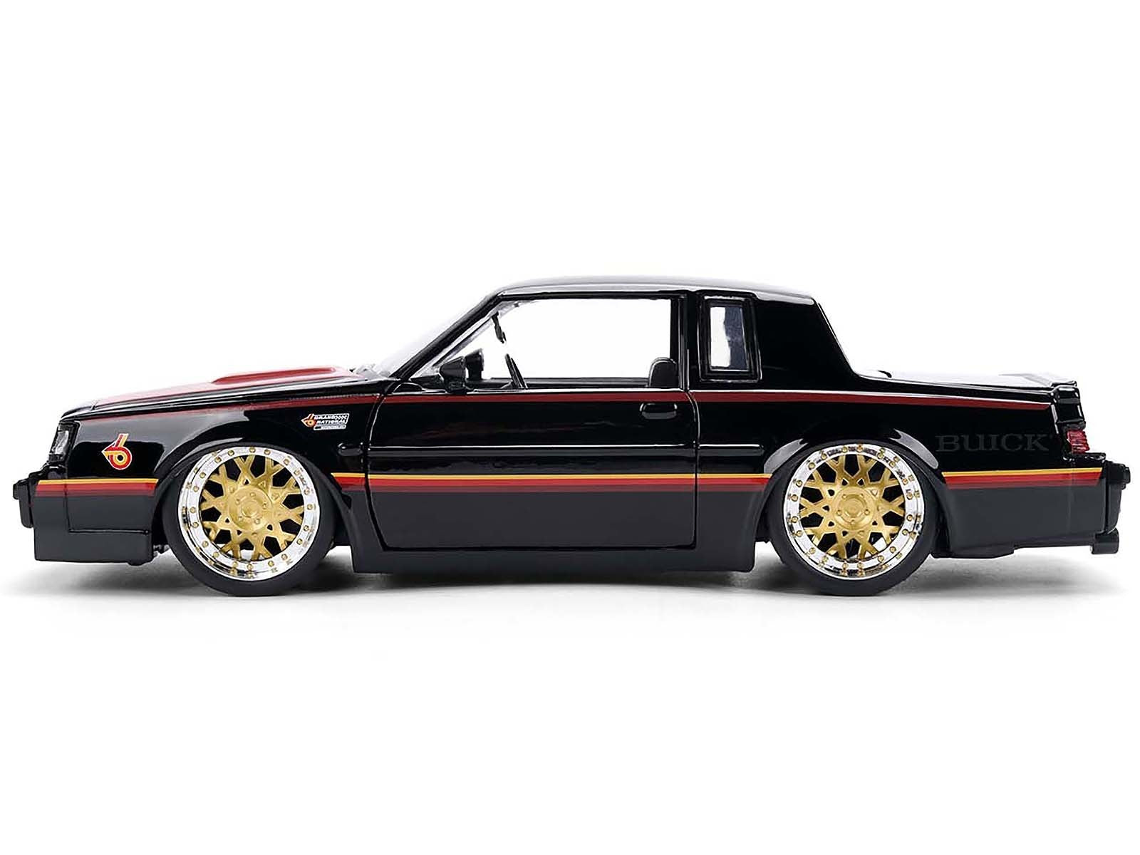 Black Buick car with gold rims on a white background