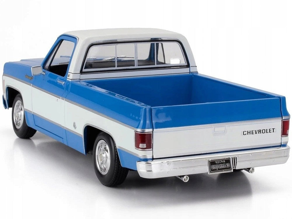 Model of a blue and white Chevrolet truck on a white background
