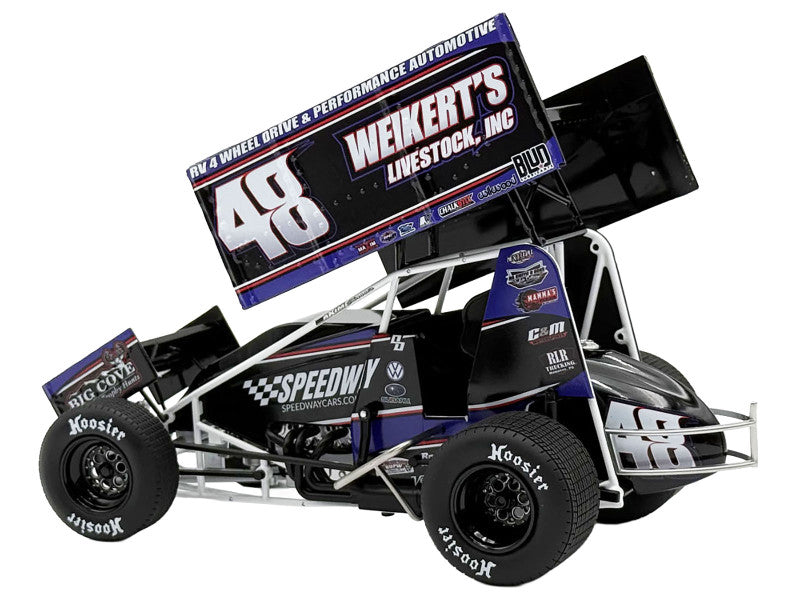 Model race car with various sponsor logos on a white background