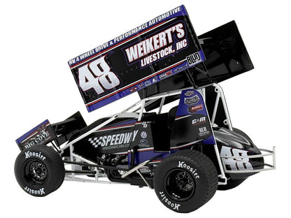 Model race car with various sponsor logos on a white background