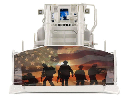 Caterpillar bulldozer with American flag and soldier silhouettes on the front