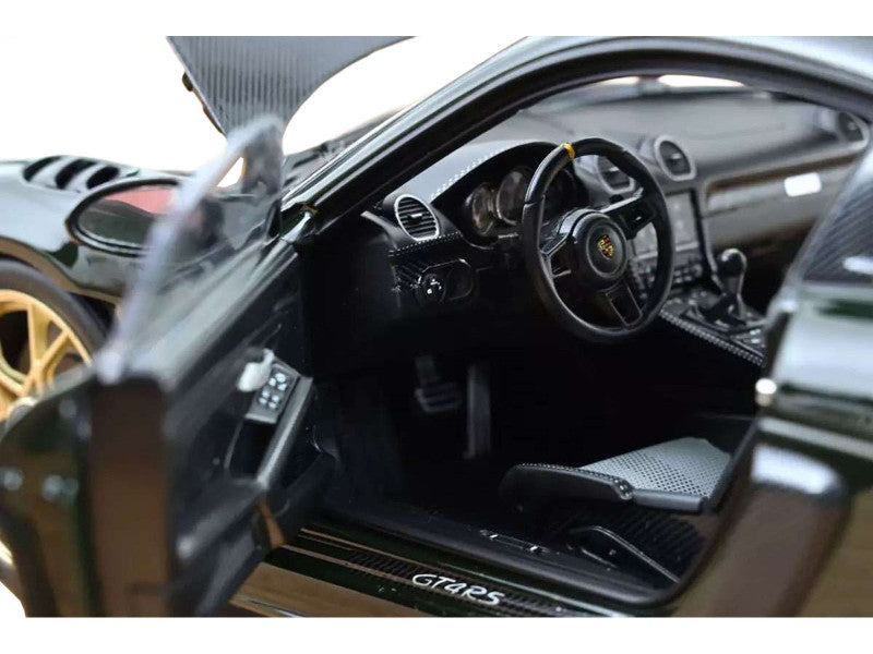 Close-up of a car's interior with 'GT4 RS' branding.