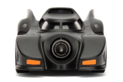 Toy car model of the Batmobile on a white background