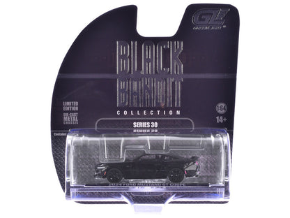 Model car in clear packaging with 'Black Collection' label on a white background