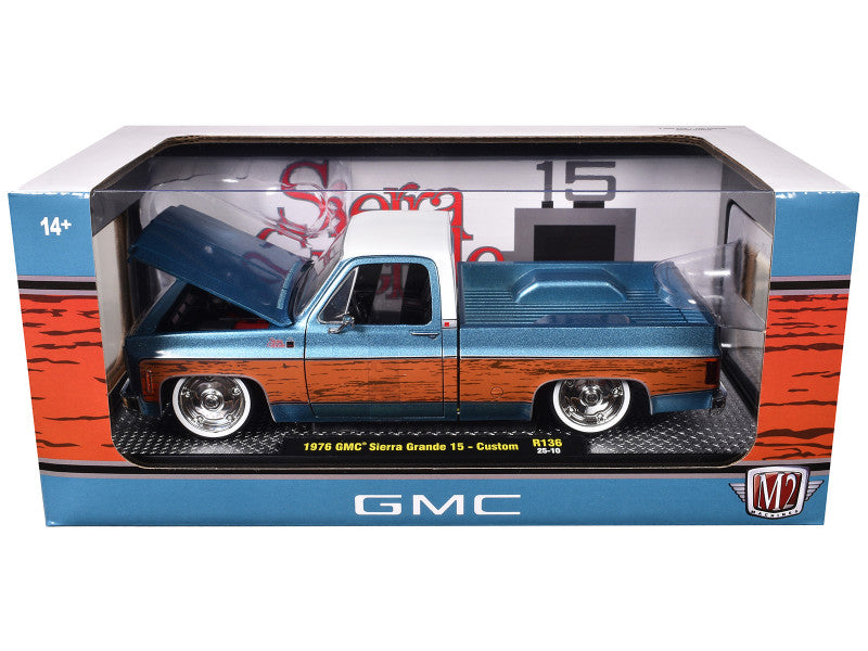 Model GMC truck in packaging with colorful design