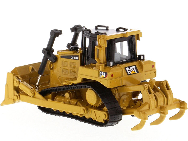 Toy bulldozer with Caterpillar logo on a white background