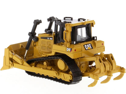 Toy bulldozer with Caterpillar logo on a white background