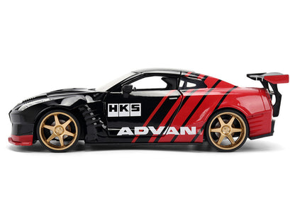 Model car with HKS and Advan branding on a white background