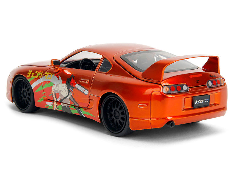 Orange toy car with character design on a white background