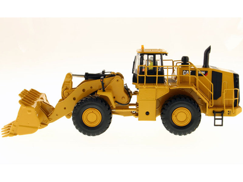 Yellow toy bulldozer with black accents on a white background