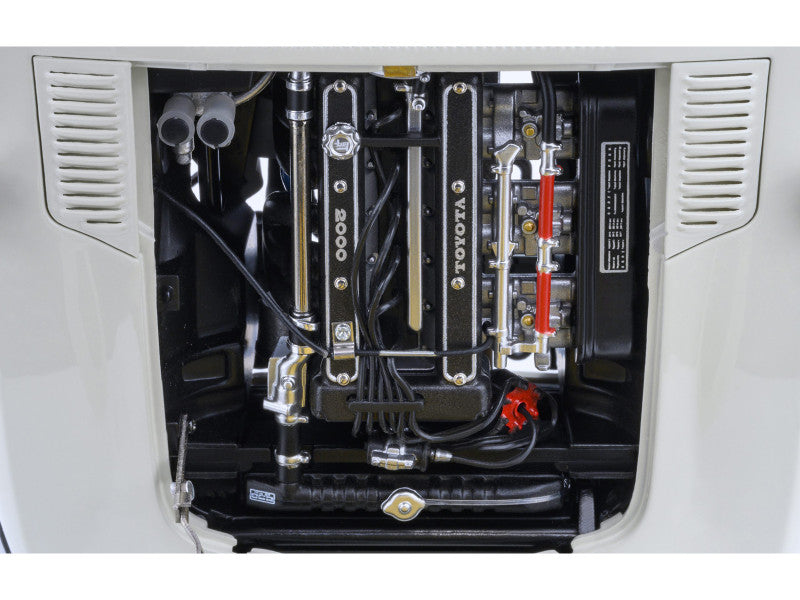 Close-up of a Toyota engine compartment with various components.