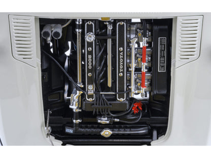 Close-up of a Toyota engine compartment with various components.