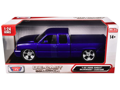 Blue die-cast truck model in a transparent box with red and white packaging