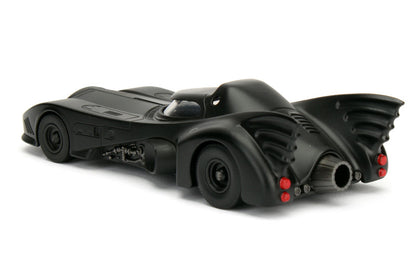 Black toy Batmobile on a white background