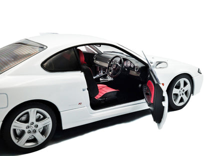 White sports car with open door on a white background
