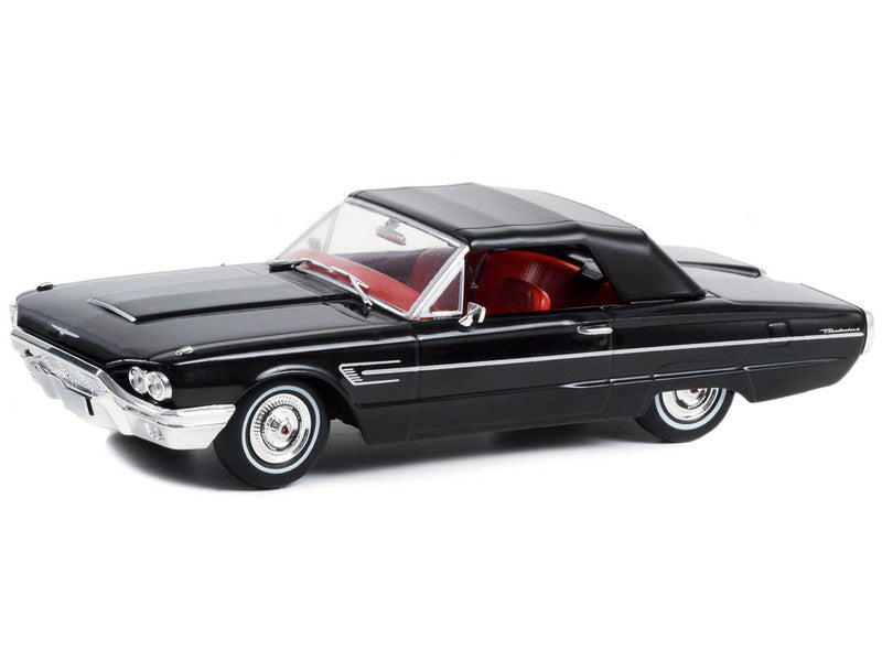 Black model car on a white background