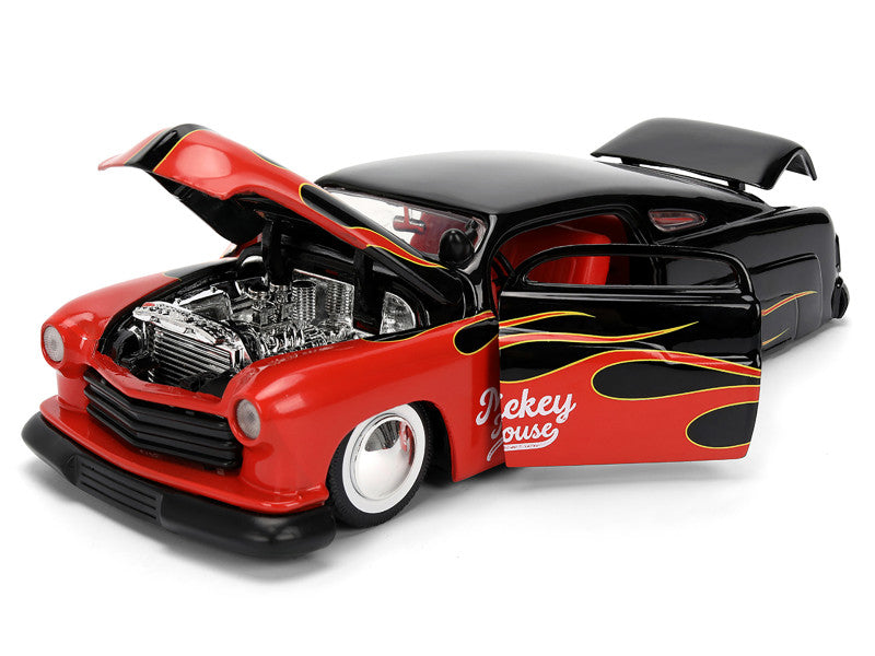 Model car with open hood on a white background