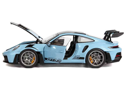 Blue sports car model with open doors on a white background
