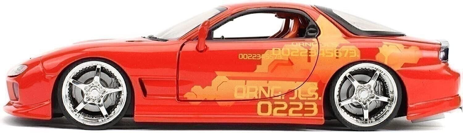 Red toy car with black and orange design on a white background