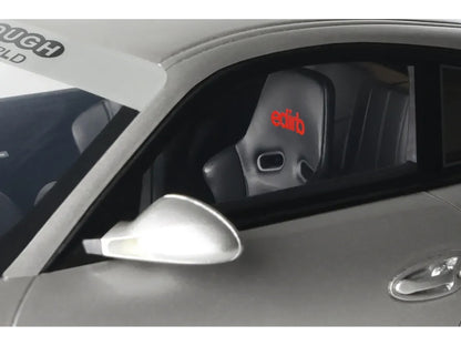Car side mirror with 'ectib' branding inside a vehicle