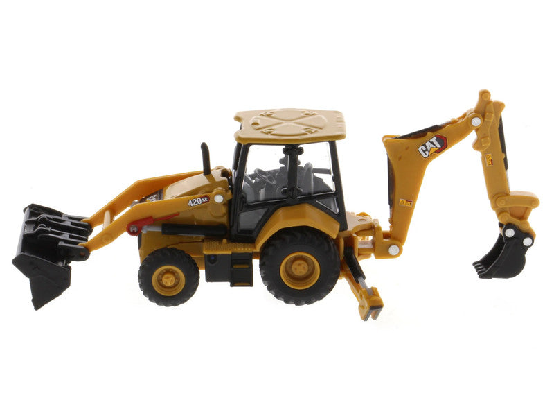 Toy backhoe loader with black bucket and yellow body on a white background