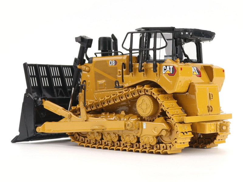 Model of a yellow Caterpillar bulldozer on a white background