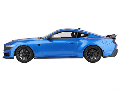 Blue sports car on a white background