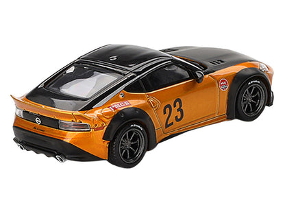 Model car with orange body and black accents on a white background