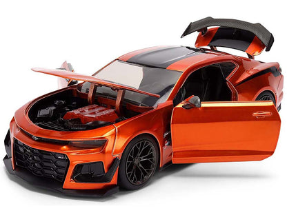 Orange sports car model with open doors and hood on a white background