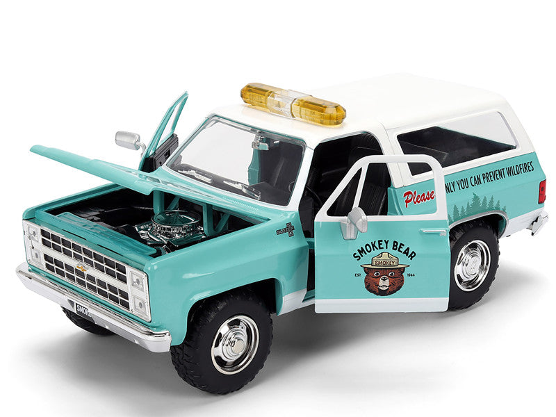 Model of a vintage truck with Smokey Bear branding on a white background