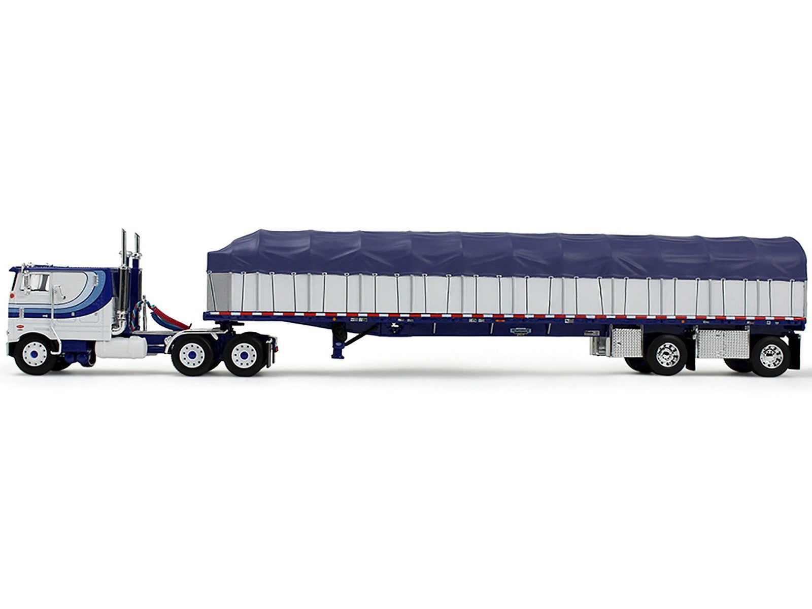 Model of a semi-trailer truck with a blue tarp on a white background