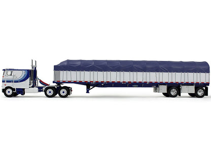 Model of a semi-trailer truck with a blue tarp on a white background