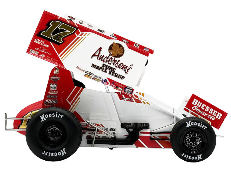 Model race car with various sponsor logos on a white background