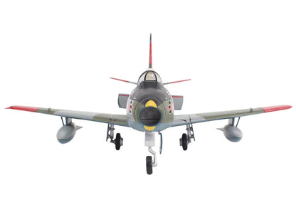Model of a vintage fighter airplane on a white background