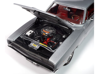 Model car with open hood showing engine details on a white background