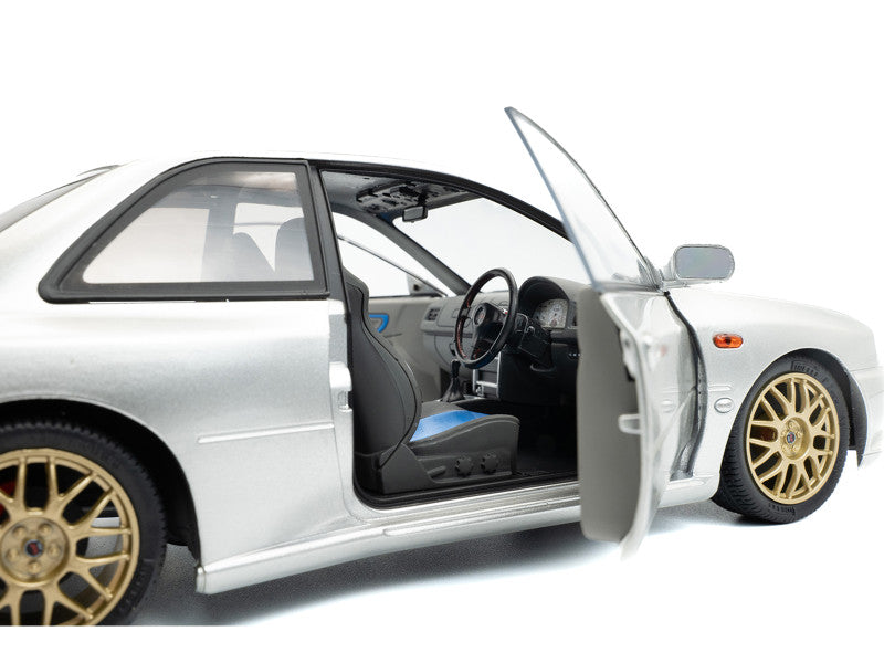 Model car with open door on a white background