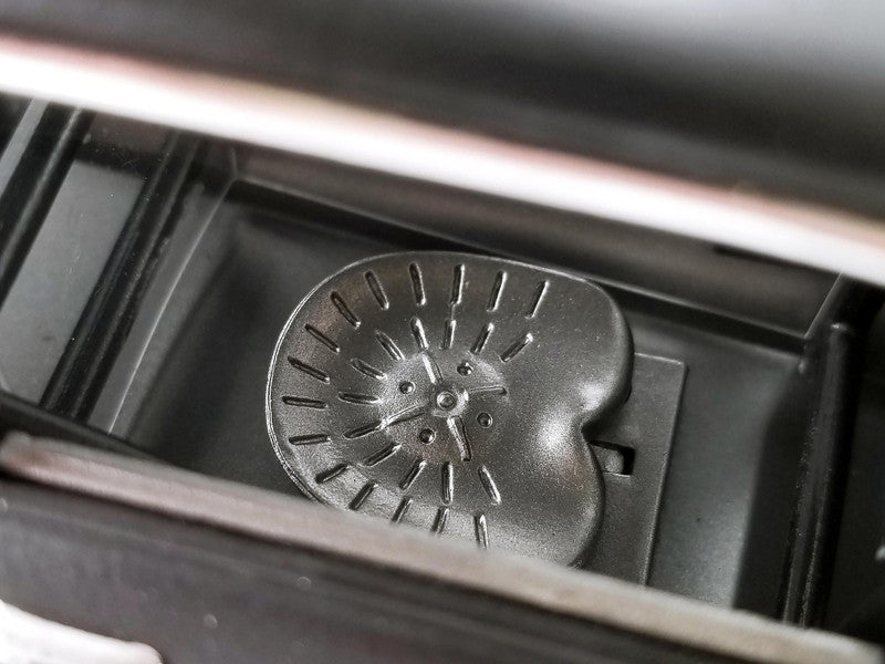 Metallic car air vent filter inside a vehicle