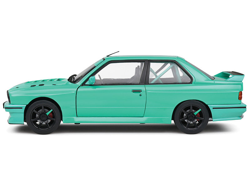 Turquoise car model on a white background