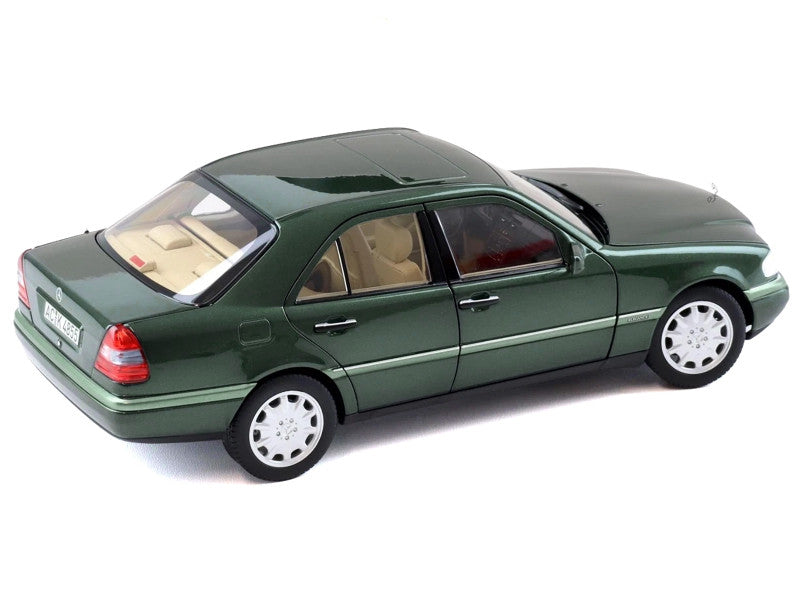 Model of a green car on a white background