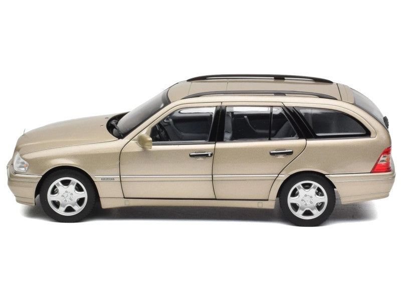 Beige station wagon on a white background
