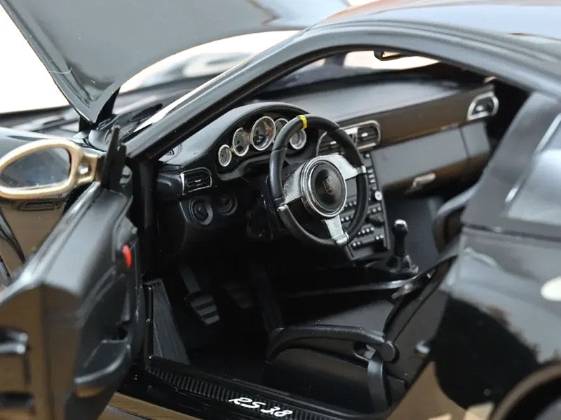 Close-up of a car's interior with steering wheel and dashboard.