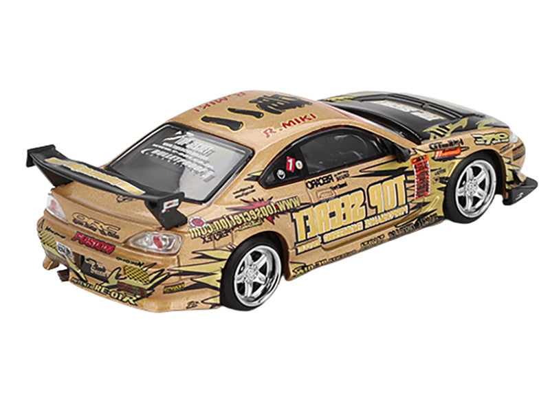 Model car with gold and black design on a white background