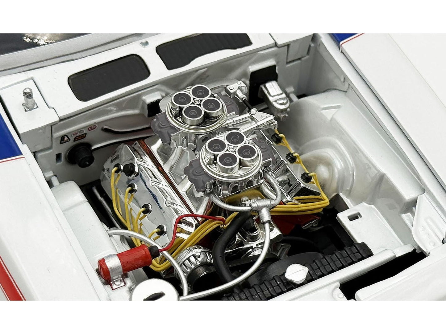 Close-up of a car engine with visible components and wiring.