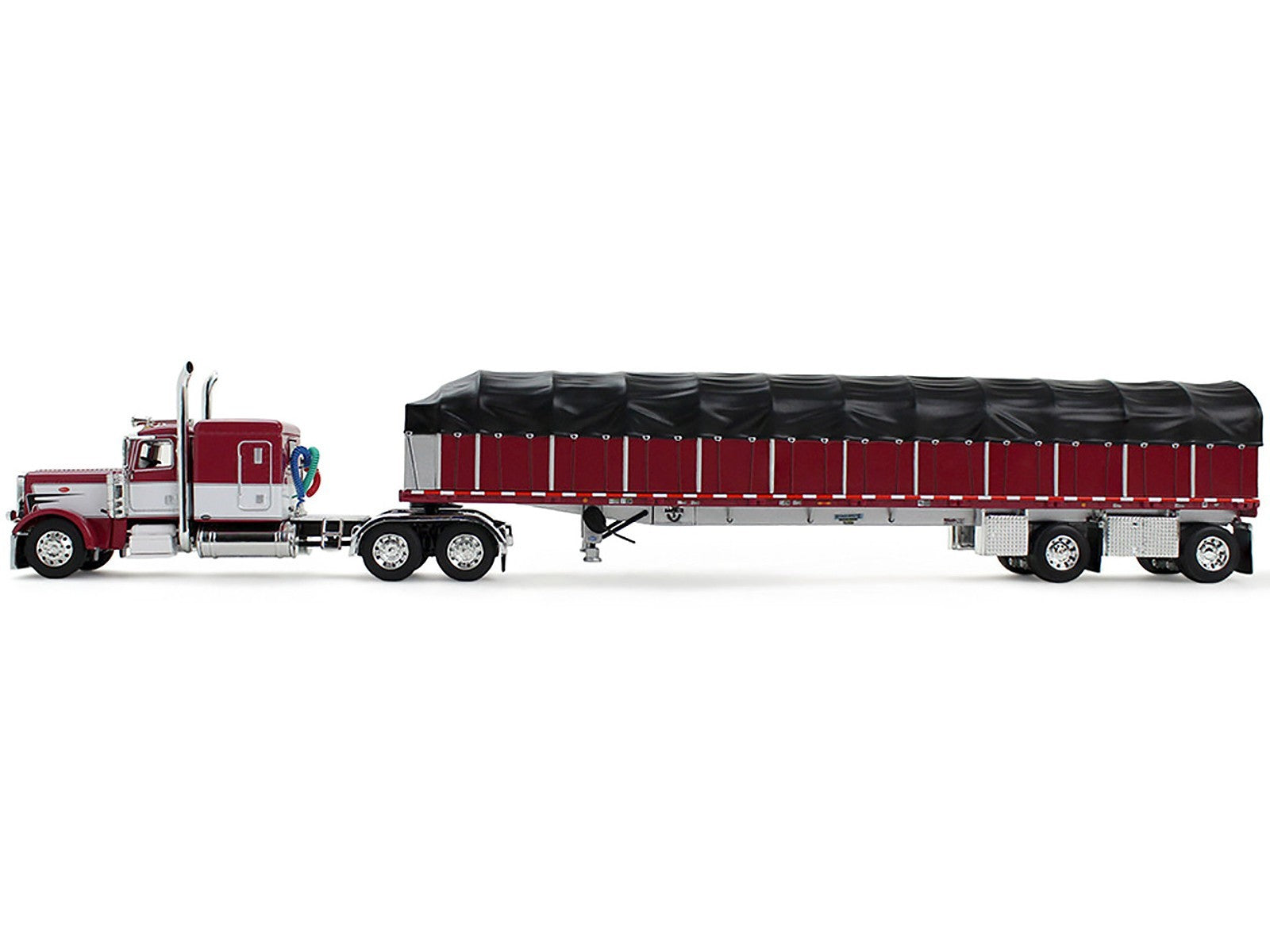 Model of a red and white truck with a black trailer on a white background