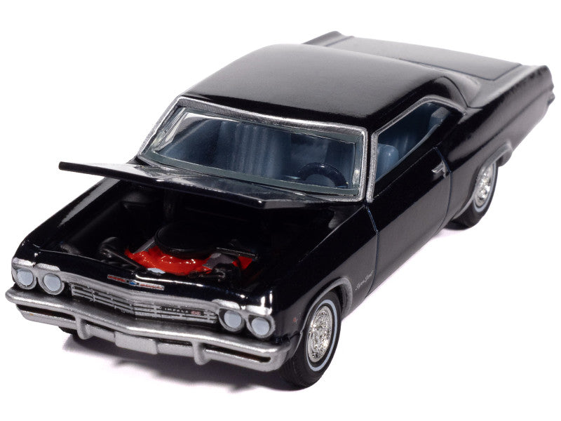 Black model car with open hood on a white background