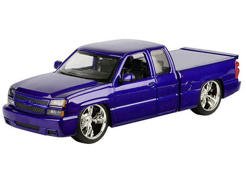 Model of a blue pickup truck on a white background