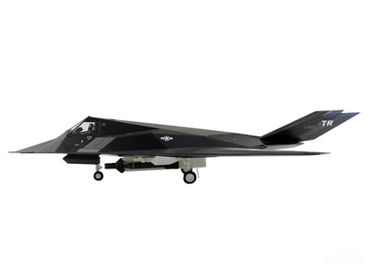 Black stealth aircraft on a white background